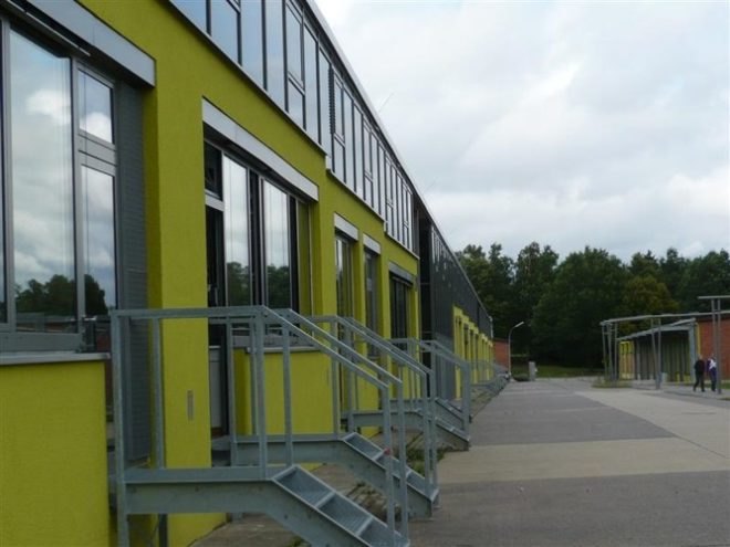 German green school, HHS Architecken, thin film solar roof, solar translucent roof, solar windows, repurposed school, reused building, solar powered school, natural ventalation