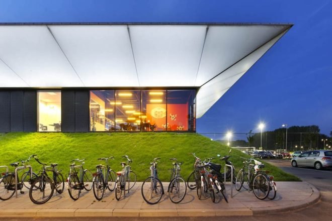 MoederscheimMoonen Architects, football club, LED area lighting, natural bleachers, Netherlands football club,