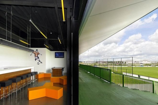 MoederscheimMoonen Architects, football club, LED area lighting, natural bleachers, Netherlands football club,