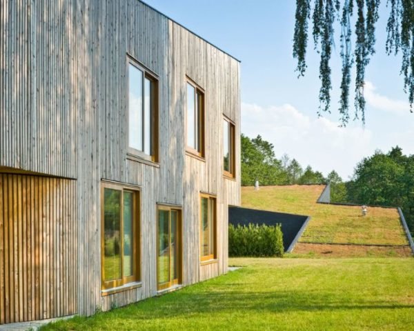 Modern Green-Roofed Homes Blend Into Poland's Countryside