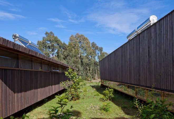 rain catchment, AATA Associate Architects, water catchment, chilean green design, Island green cabin, easter island cabin, green cabin design, prefab cabin, natural ventilation, solar batch heater, eco cabin, eco vacation, green tourist cabin,