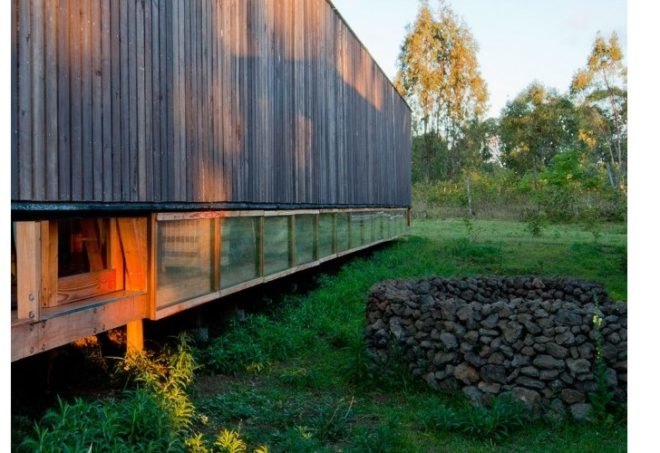rain catchment, AATA Associate Architects, water catchment, chilean green design, Island green cabin, easter island cabin, green cabin design, prefab cabin, natural ventilation, solar batch heater, eco cabin, eco vacation, green tourist cabin,