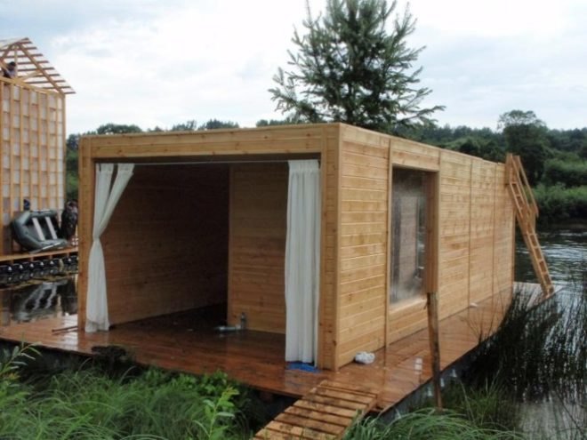 Russian festival, floating Finnish sauna, Festival of Landscape Objects, Sauna, tree on roof, floating house, floating houses, green sauna, Rintala Eggertsson Architects