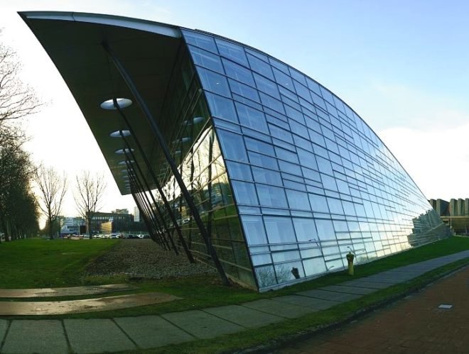 Mecanoo Architecten, green library, green roof, green building Netherlands, dutch green building, green campus, library daylighting, sled roof, ski roof, 1990s green architecture, eco library,
