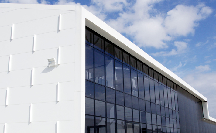 solar energy, solar power, photovoltaic panels, passive design, south-facing, Greece, solar panel factory, solar gain, energy efficiency, green design, Henning Larsen