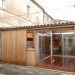 urban green studio conversion, built in rooms, FABRE/deMARIEN architectes,russian green buildign, garage convertion, eco convertion, wooden rolling shutters,