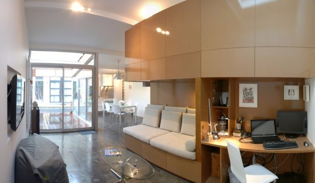 urban green studio conversion, built in rooms, FABRE/deMARIEN architectes,russian green buildign, garage convertion, eco convertion, wooden rolling shutters,