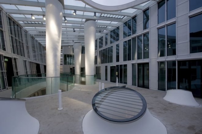 Markthäuser, Rebstockplatz, green atrium design, Urban renewal, terracotta facade, strip building facade, day lit central atrum, Mainz green building, Studio Fuksas, eco mixed use, German urban green design,