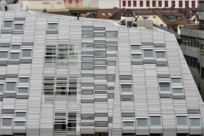 Markthäuser, Rebstockplatz, green atrium design, Urban renewal, terracotta facade, strip building facade, day lit central atrum, Mainz green building, Studio Fuksas, eco mixed use, German urban green design,