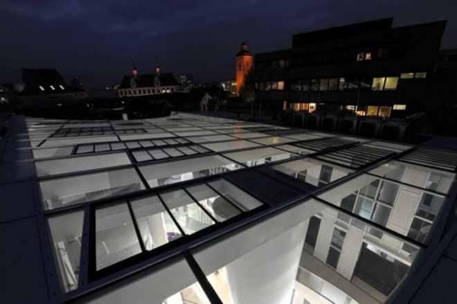 Markthäuser, Rebstockplatz, green atrium design, Urban renewal, terracotta facade, strip building facade, day lit central atrum, Mainz green building, Studio Fuksas, eco mixed use, German urban green design,