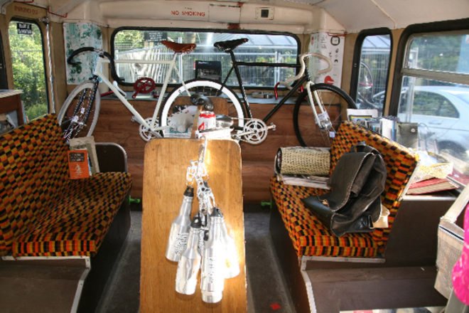 the bicycle library, bicycle library, bike library, bike rental, green design, eco design, sustainable design, green architecture, eco architecture, rent a bike, repurposed double decker bus, recycled double decker bus, karta healy