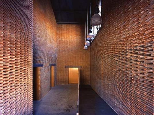 Warehouse 8B is An Avant Garde Office Made From Recycled Roof Shingles
