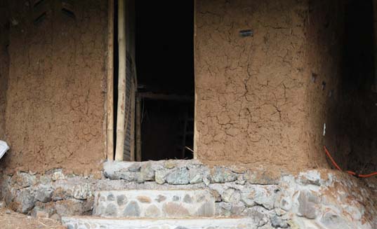 mud house, palawan, mud walls, stone steps, sustainable building, front door