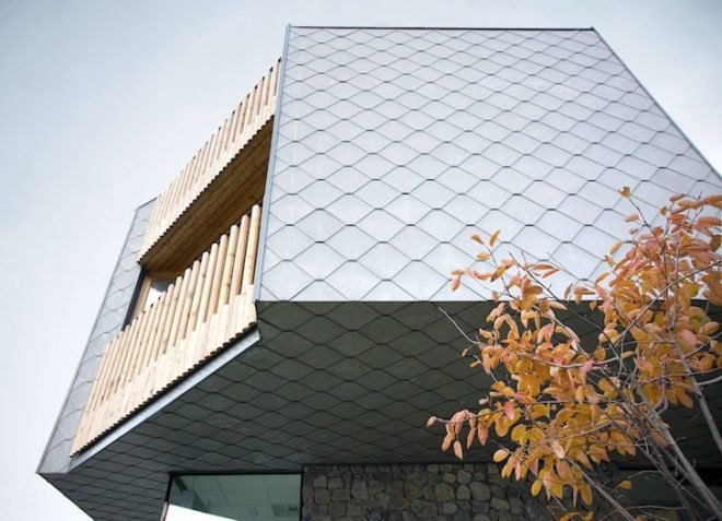 scalloped skin, alpine, slovenia, ski complex, ski apartments, OFIS, OFIS arhitekti, vernacular architecture, local tradition, local architecture, green building, green design, sustainable design, eco design