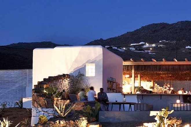green roof,Green Materials,Green Lighting,green Interiors,Eco Travel,Architecture,pumpking lights,reed roof,greece,mykonos,seaside restaurant,Cycladic Architecture,lime white,locally sourced materials,local stones