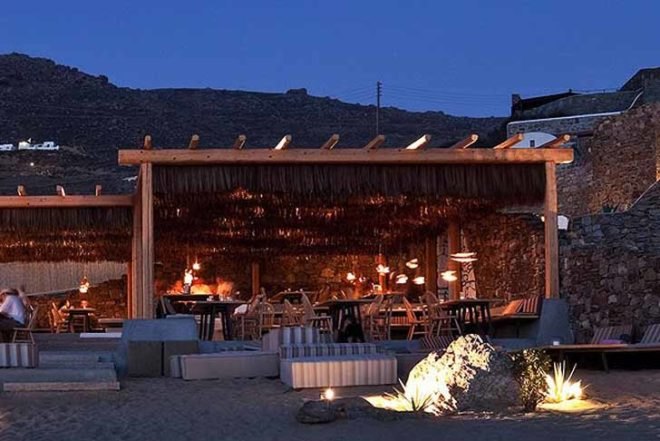 green roof,Green Materials,Green Lighting,green Interiors,Eco Travel,Architecture,pumpking lights,reed roof,greece,mykonos,seaside restaurant,Cycladic Architecture,lime white,locally sourced materials,local stones