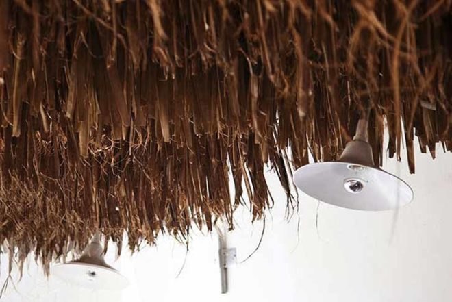 green roof,Green Materials,Green Lighting,green Interiors,Eco Travel,Architecture,pumpking lights,reed roof,greece,mykonos,seaside restaurant,Cycladic Architecture,lime white,locally sourced materials,local stones