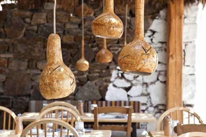 green roof,Green Materials,Green Lighting,green Interiors,Eco Travel,Architecture,pumpking lights,reed roof,greece,mykonos,seaside restaurant,Cycladic Architecture,lime white,locally sourced materials,local stones