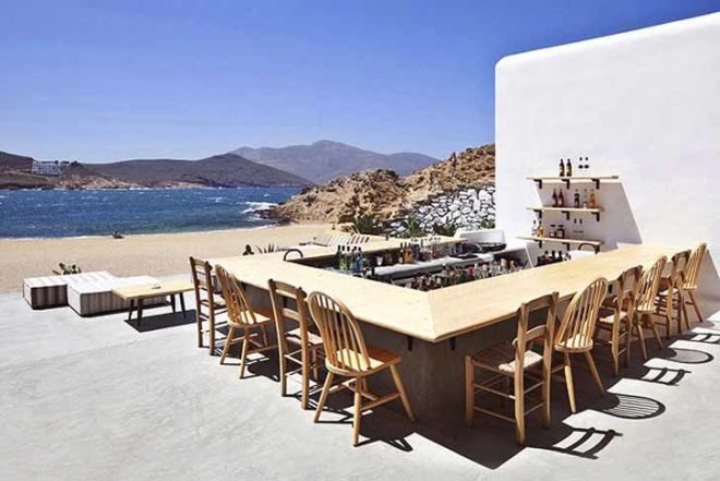 green roof,Green Materials,Green Lighting,green Interiors,Eco Travel,Architecture,pumpking lights,reed roof,greece,mykonos,seaside restaurant,Cycladic Architecture,lime white,locally sourced materials,local stones
