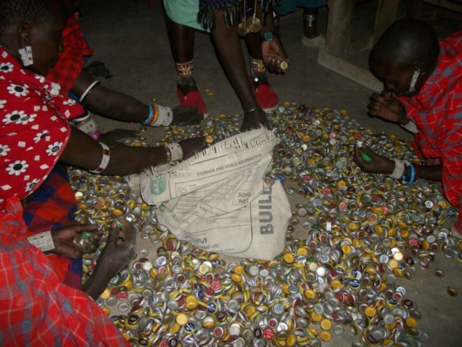 15, 000 Bottle Caps for Africa; Under the Acacia; Charles Newman; Charles Newman Design; recycled materials; recycled bottlecaps; reused materials; repurposed materials; social design; low impact; traditional techniques; Maasai; Maasai culture; Kenya; Africa; Village Earth; Habitat for Humanity; Inhabitat; Engineers Without Borders; Jess Teutonico; Loita Hills; Greystone Learning Center; Greystone Aviation; Internet Society; Adele’s Literacy Library