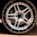 friction reducing tire, Energy Return Wheel, ERW, airless tire, spring tire, green tire, eco tire, improved MPG, redesigned tire, double hoop tire,