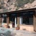 Arizona cave, Arizona green home, cave architecture, cave for sale, cave house, cave house design, eco home, green home, house blasted into hill, house cave, natural cooling, natural pool, rock house, underground home