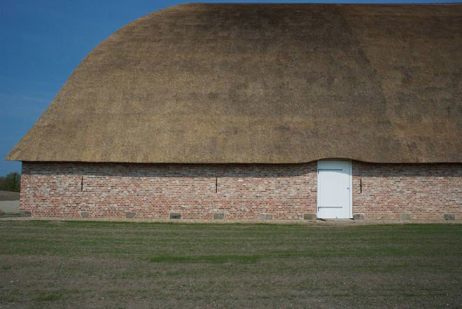 Danish design, barn, recycled barn, refurbished barn, Praksis, terrazzo floor, red-bricked wall, biodegradable roof, straw roof, thatched roof, flexible space, exhibitions space, curved wooden walls, denmark