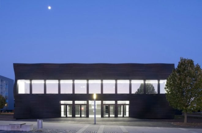 Deubzer Konig Rimmel Architekten, interims audimax, munich's technical university, undulating surface, germany lecture hall, wooden lecture theater, sustainable wooden design, green design, spruce architecture