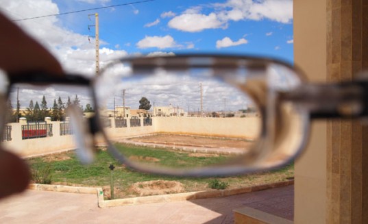 eyejusters, self adjusted glasses, vision correction, green glasses, slidelens technology, eyejusters slidelens