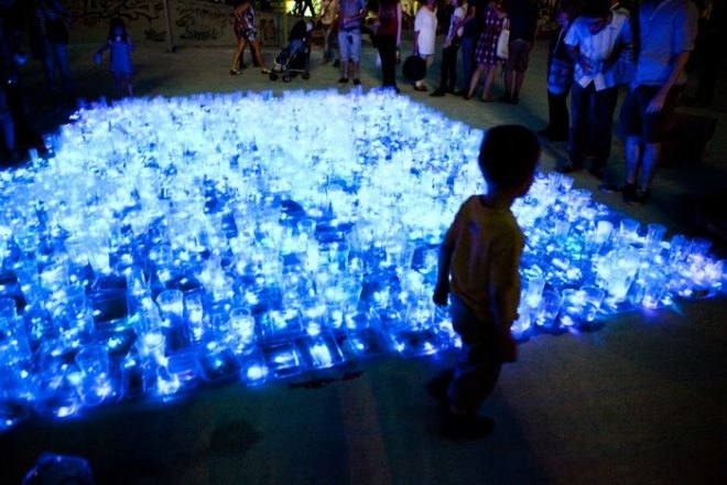 luzinterruptus, public installation, madrid intervention, recycled materials, reused containers, plaza de la cebada, public artwork, community art, sustainable art
