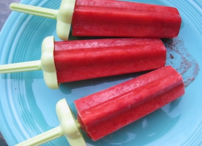 Red popsicles on a blue plate