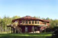 wraparound deck around round house, two story round home, icf built house, circle house
