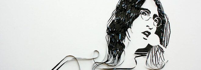 A portrait of John Lennon made out of casette tape.