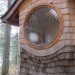 round window, curved roof, house in the woods, handsplit shingles