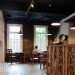 afé has a selection of old recycled chairs and tables, which include church seating and school chairs.