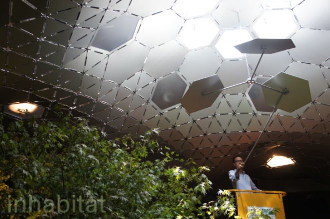 The Low Line Exhibit - Architect James Ramsay fiddles with the solar reflectors