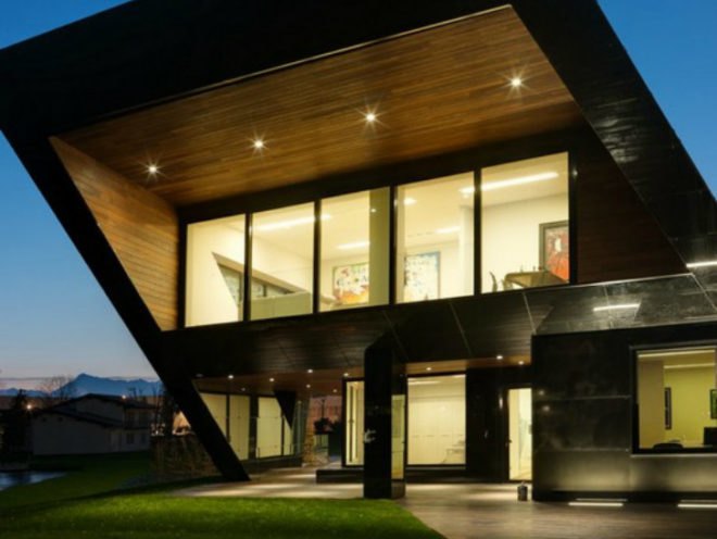 This bold sculpture is actually an office building in Piemonte, Italy and features a number of energy efficient features. Designed by Damilano Studio Architects, the Oficina Vidre Negre is composed of a series of angular volumes clad in black glass panels and integrated photovoltaic panels. The high performance envelope is combined with efficient mechanical systems and daylighting to achieve a low energy office.