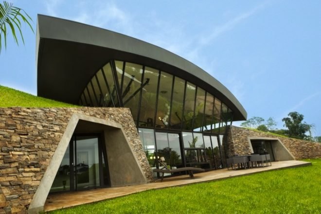 BAUEN, Two Houses, Paraguay, green roof, sweeping arched roofs, green design, natural materials, sustainable design, eco-design, cave homes, eco-luxe architecture