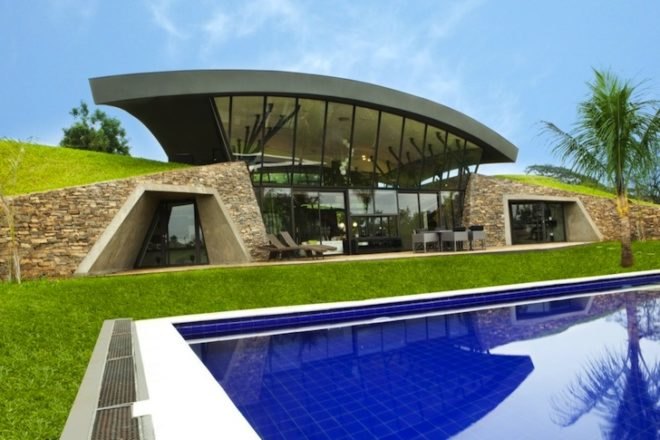 BAUEN, Two Houses, Paraguay, green roof, sweeping arched roofs, green design, natural materials, sustainable design, eco-design, cave homes, eco-luxe architecture