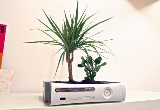 curly productions, xbox 360, xbox 360 planter, recycled video game system, green design, recycled materials, indoor planter. sustainable design, recycled e-waste, gardening, indoor gardening, repurposed video game console, recycled xbox