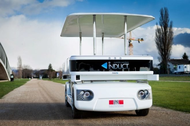 Induct, Navia, electric shuttle, electric vehicle, wireless charging, driverless vehicle, autonomous vehicle, pedestrians, urban areas, transportation, mobility