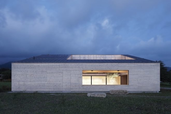 Austria, Bernardo Bader, timber home, wooden home, central courtyard, home with a green lung, green design, sustainable design, eco-design, daylighting, natural ventilation, tree in the center of the house, louvers, Vorarlberg