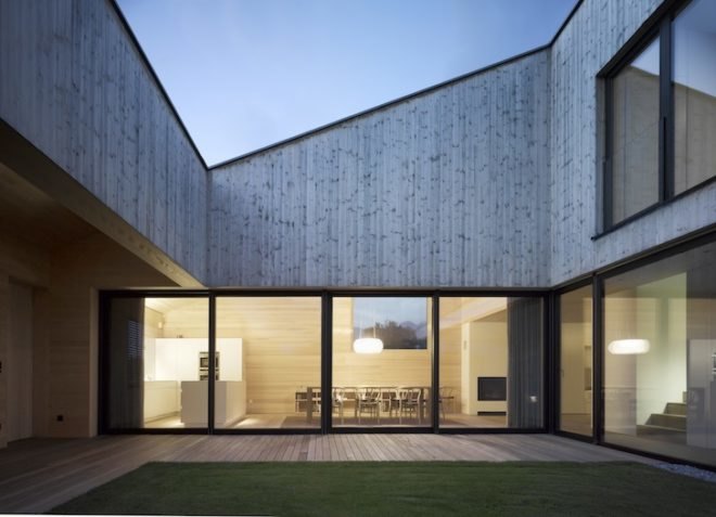 Austria, Bernardo Bader, timber home, wooden home, central courtyard, home with a green lung, green design, sustainable design, eco-design, daylighting, natural ventilation, tree in the center of the house, louvers, Vorarlberg