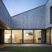 Austria, Bernardo Bader, timber home, wooden home, central courtyard, home with a green lung, green design, sustainable design, eco-design, daylighting, natural ventilation, tree in the center of the house, louvers, Vorarlberg