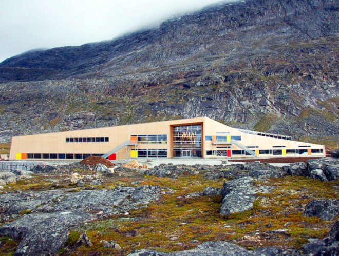 atuarfik hans lynge school, qinngorport, nuuk, greenland, khr arkitektur a/s, new school building in greenland, school building that withstands harsh winds, troldteck, eco-friendly acoustic panels, using color to enliven a gray background in Greenland, masterplanned marketplace in Qinngorport