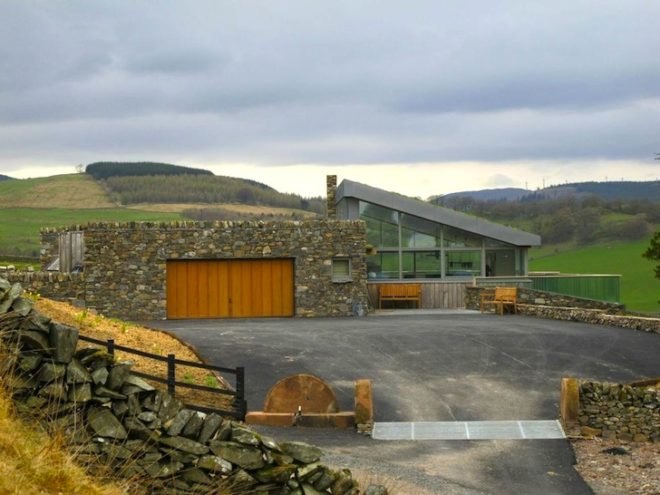 sheep's wool insulation, green design, sustainable design, eco design, sustainable scottish farmhouse, stone farmhouse in scotland, wind-powered home in scotland, wind energy, solar energy, green roof home in Scotland, triple glazing, energy efficiency, UK energy standards
