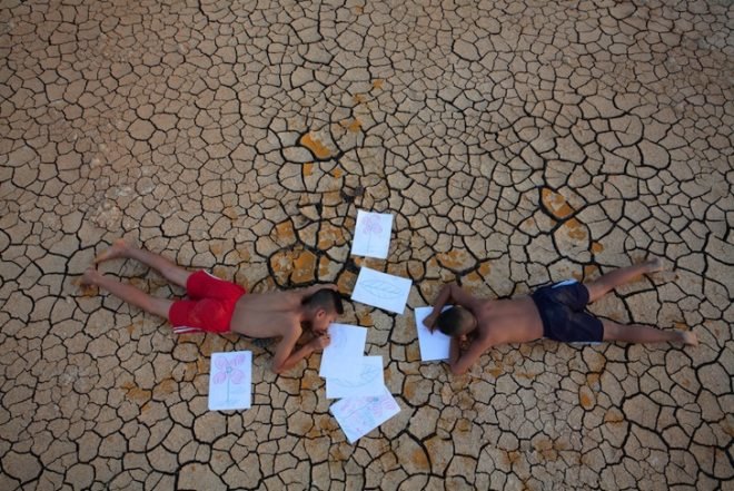 climate refugees, climate change, Lord Stern Grantham Research Institute on Climate Change, news, 400ppm carbon dioxide levels, melting ice caps, rising sea levels, desertification, environmental news, rising temperatures, crop failure, armed conflict from climate change
