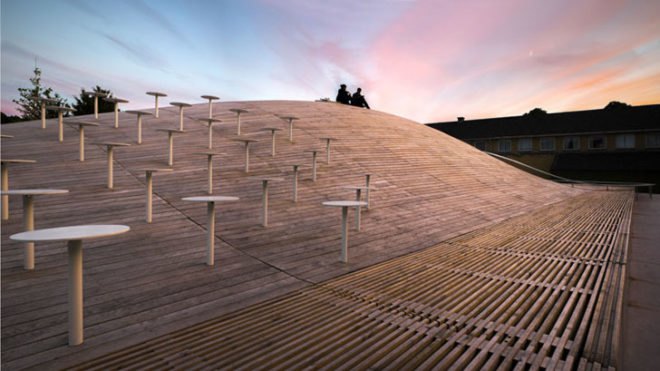 BIG, underground facility, form follows function, retrofit architecture, courtyard, custom benches, LED lighting, solar panels, underground architecture, organic courtyard