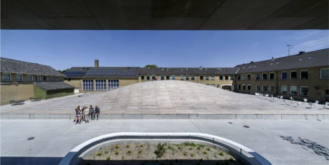 BIG, underground facility, form follows function, retrofit architecture, courtyard, custom benches, LED lighting, solar panels, underground architecture, organic courtyard