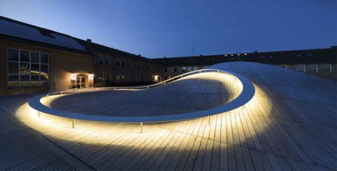 BIG, underground facility, form follows function, retrofit architecture, courtyard, custom benches, LED lighting, solar panels, underground architecture, organic courtyard